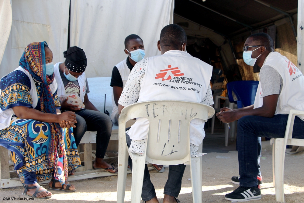 MSF staff meeting in Pulka hospital: humanitarians sitting in a circle during a meeting.