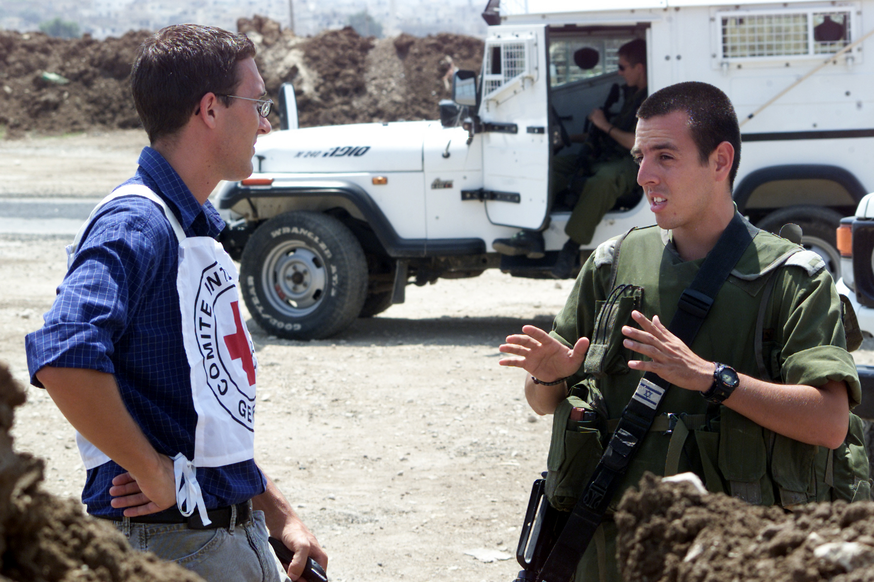 An ICRC delegates talks with military authorities.