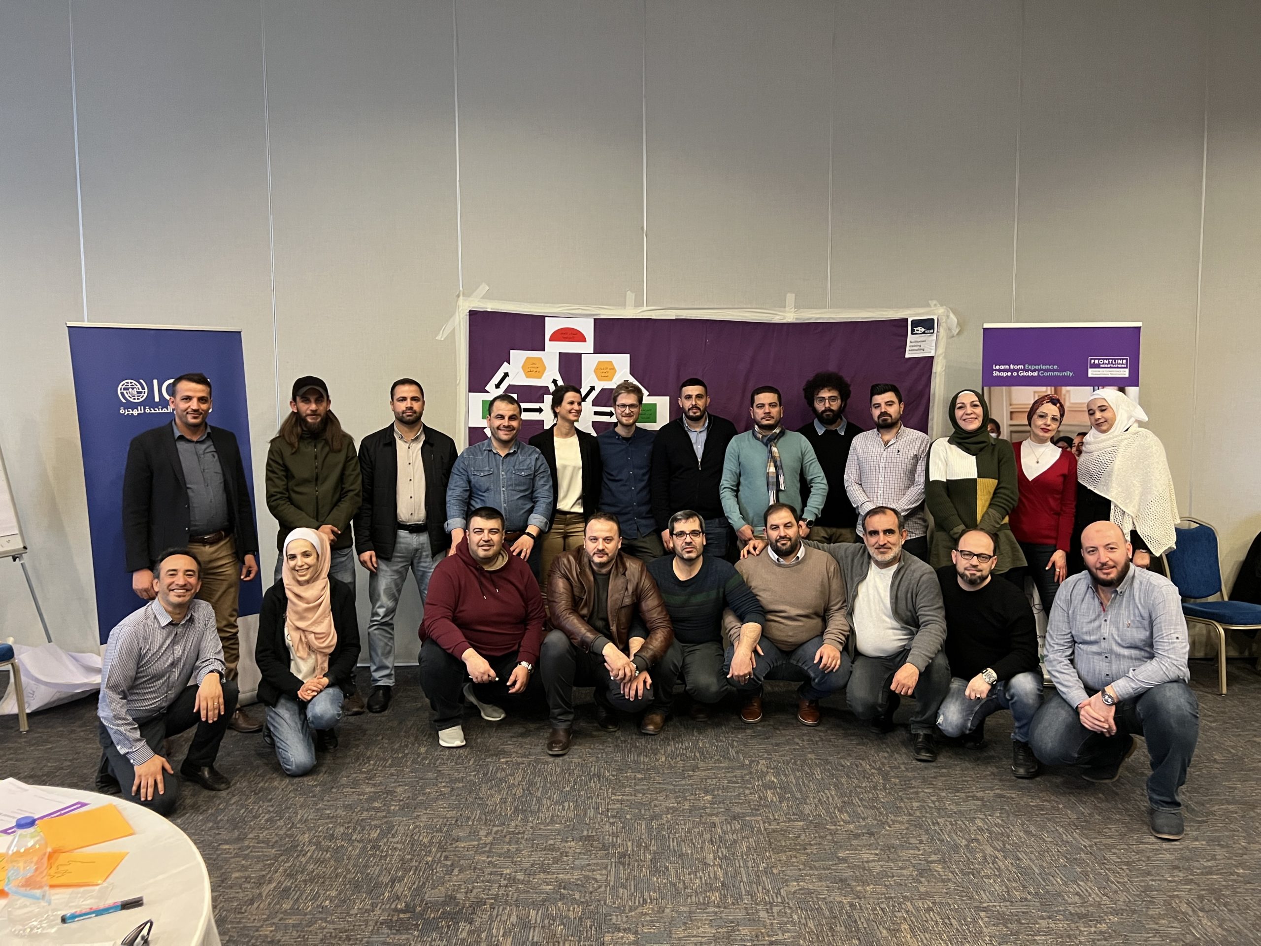 Training of Facilitators participants take a group photo.